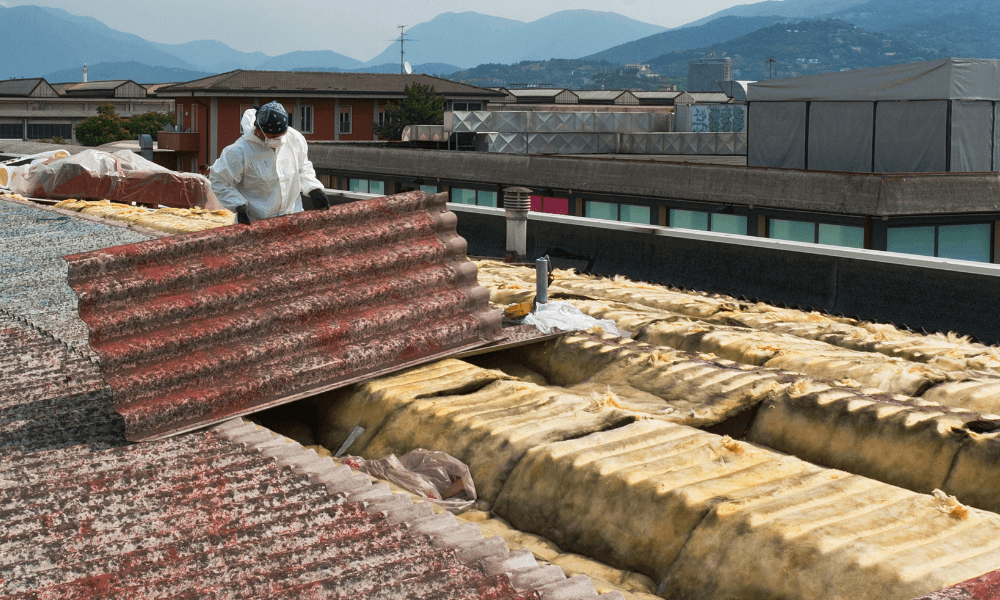 Man wearing a hazmat suit handling asbestos