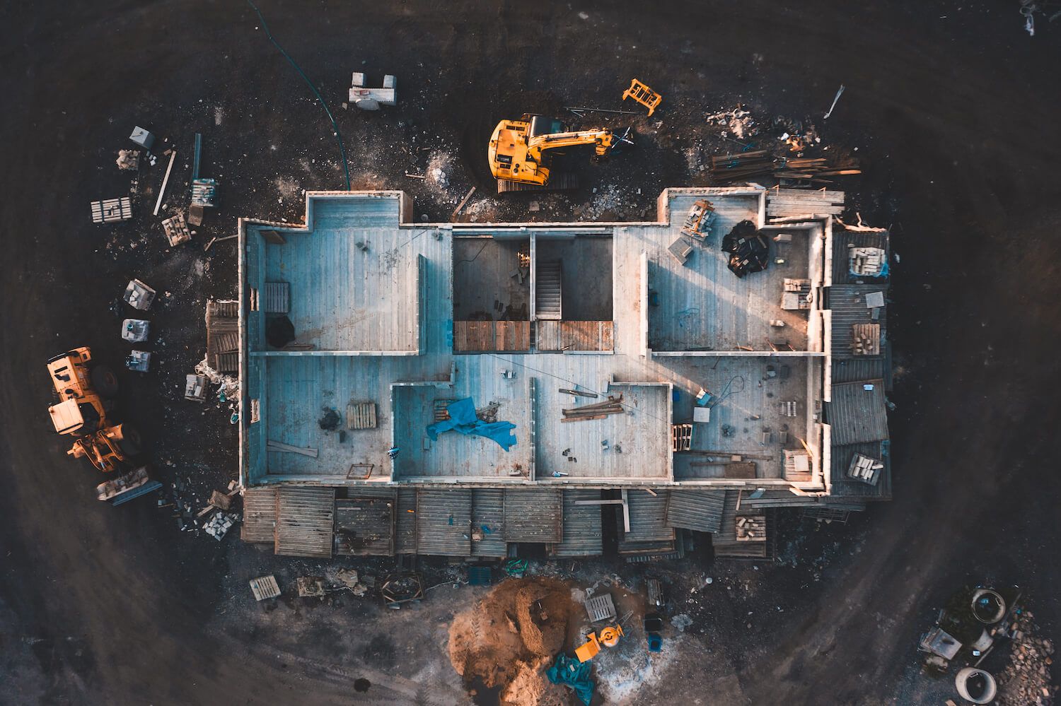 overview of a construction site of a building with no roof