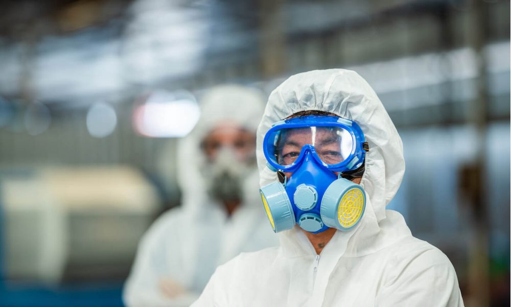 Male inspector team investigate danger chemical gas leak spill with safety face mask PPE