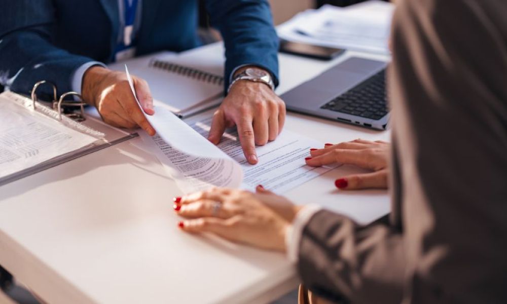 lawyer discussing documents with a client