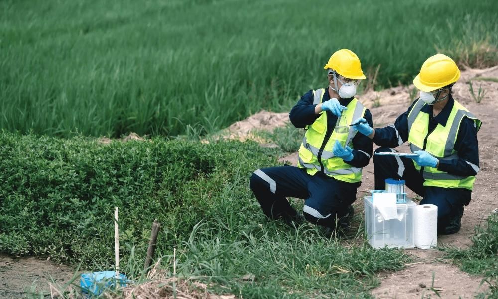 Environmental engineers testing water for PFAs