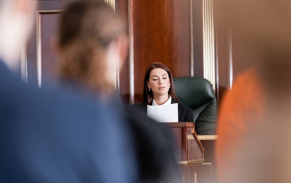 Female judge reading from court documents