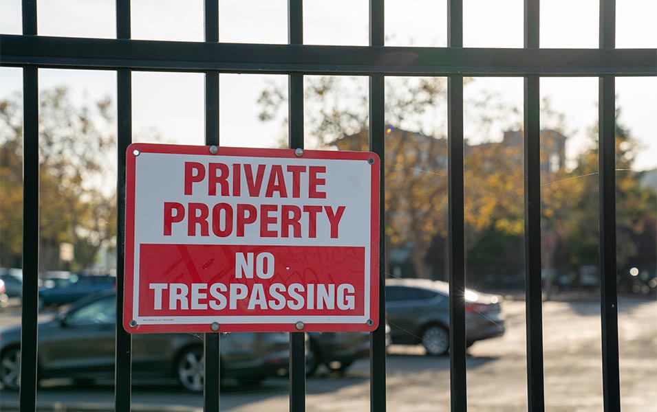 private property sign hanging on a gate