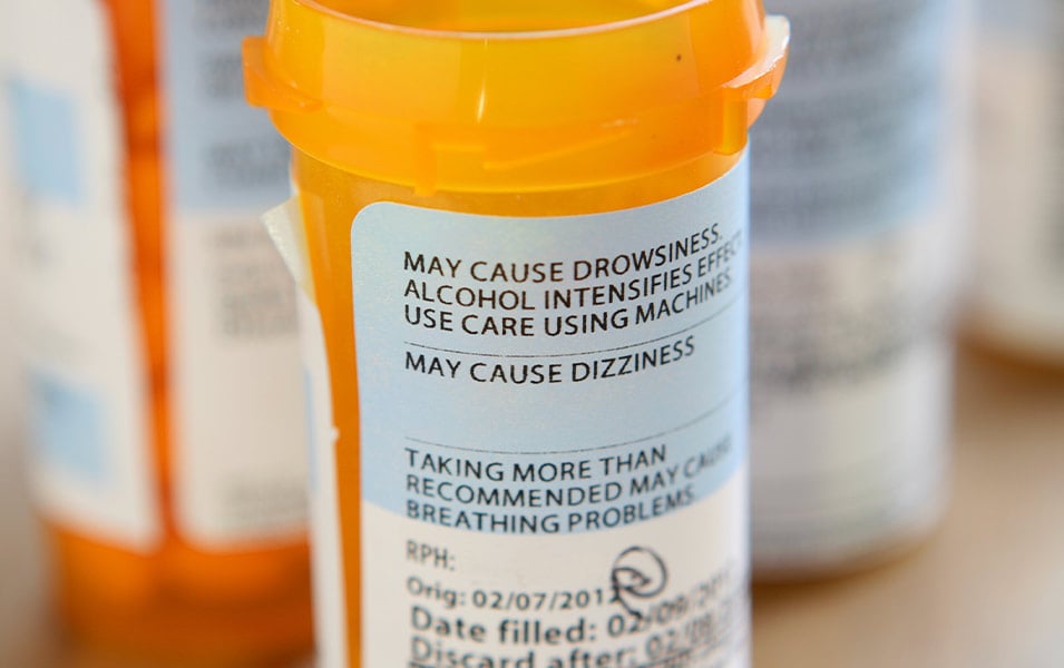 pill bottle with warning labels on the side